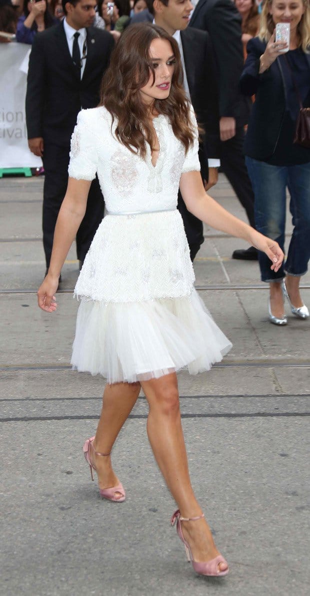 Keira Knightley dazzles in a white lace and tulle dress paired with pink heels