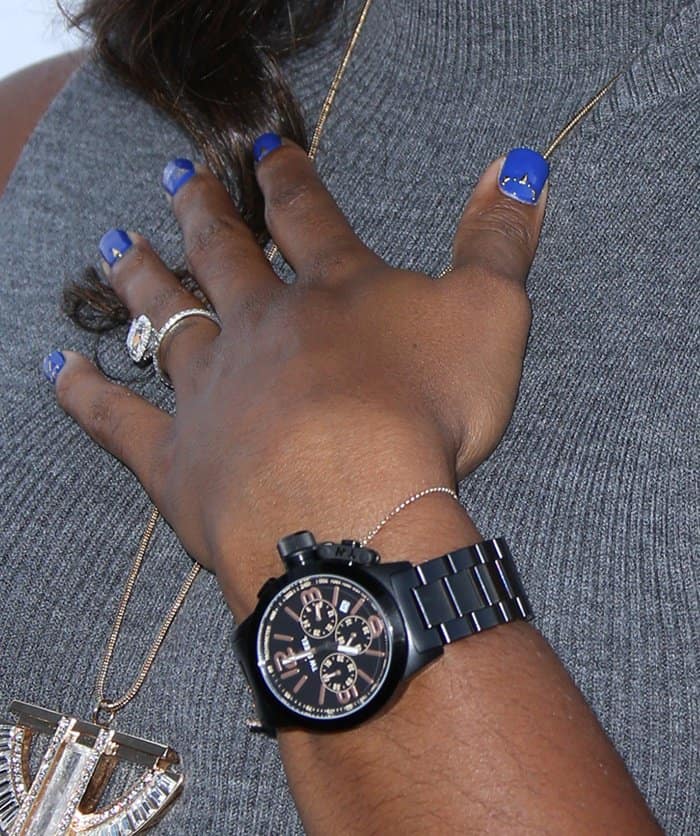 Kelly Rowland shows off her bold black TW Steel watch, eye-catching blue manicure, and dazzling diamond ring