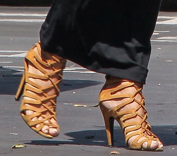 Kim Kardashian displays her feet in her favorite Hermes lace-up heels