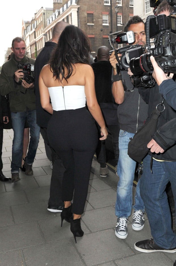 Kim Kardashian styled her jumpsuit with black ankle boots