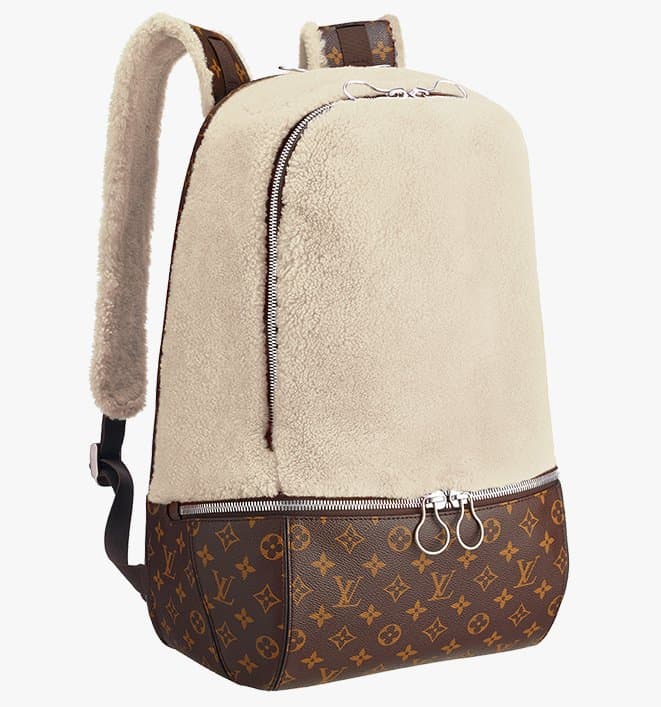 Marc Newson’s $5,900 ‘Fleece Pack’ blends functionality with luxury, featuring cozy shearling, monogram canvas, custom hardware, and a structured design meant to stand upright—crafted in neutral, blue, and orange colorways