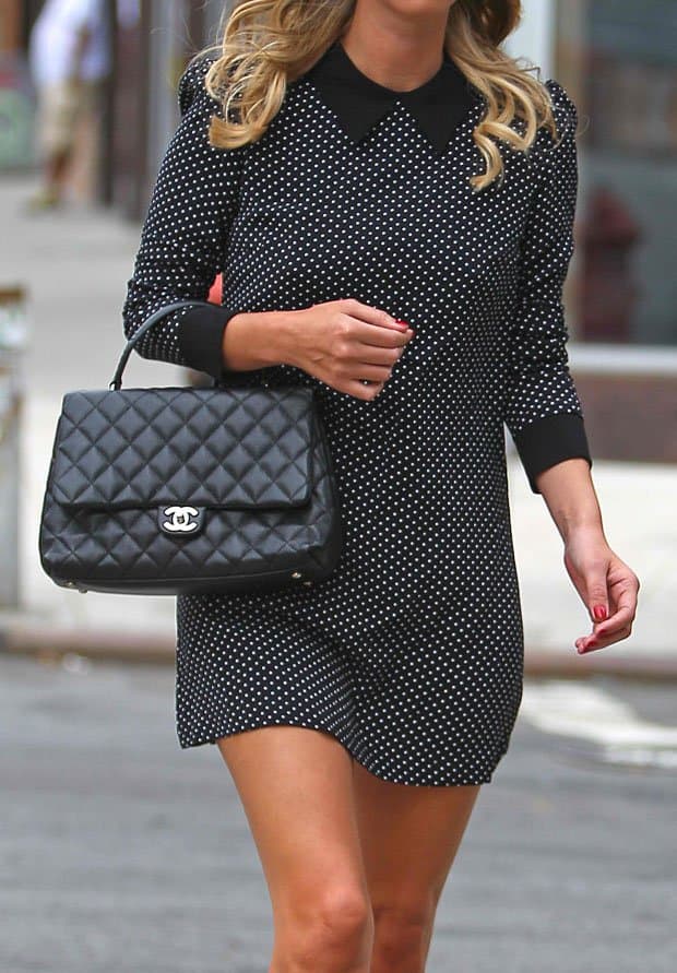 Nicky Hilton's black Chanel top-handle bag and long-sleeved polka-dot shift dress