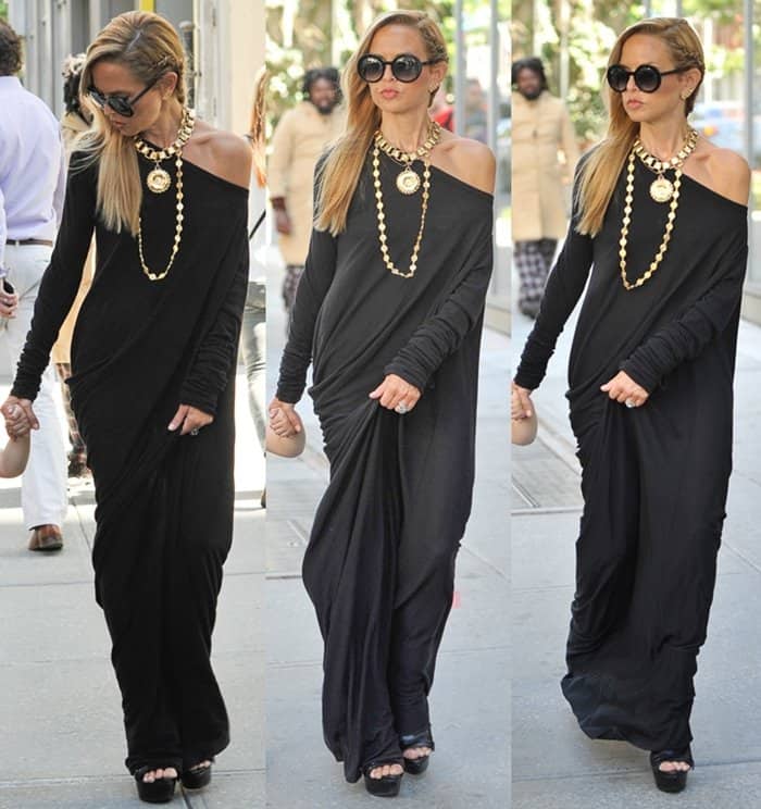 Rachel Zoe exudes effortless chic in an off-the-shoulder black maxi dress, elevated with bold, chunky accessories