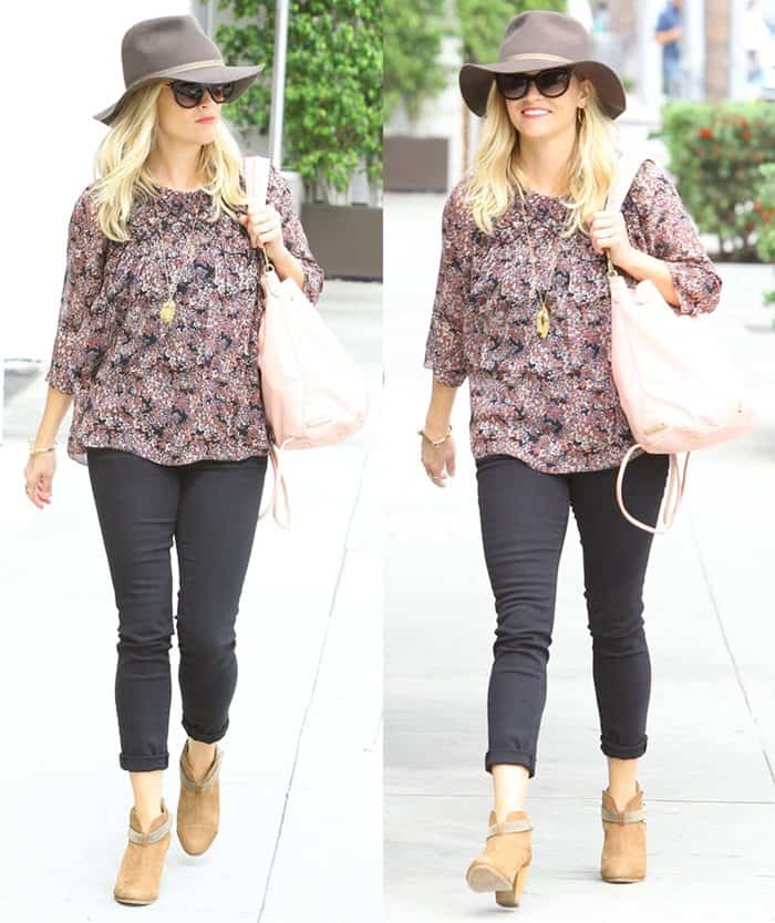Reese Witherspoon steps out in Santa Monica wearing tan Rag & Bone Harrow leather ankle boots, pairing them effortlessly with cuffed skinny jeans, a floral blouse, and a floppy felt hat for a chic, boho-inspired daytime look on September 4, 2014