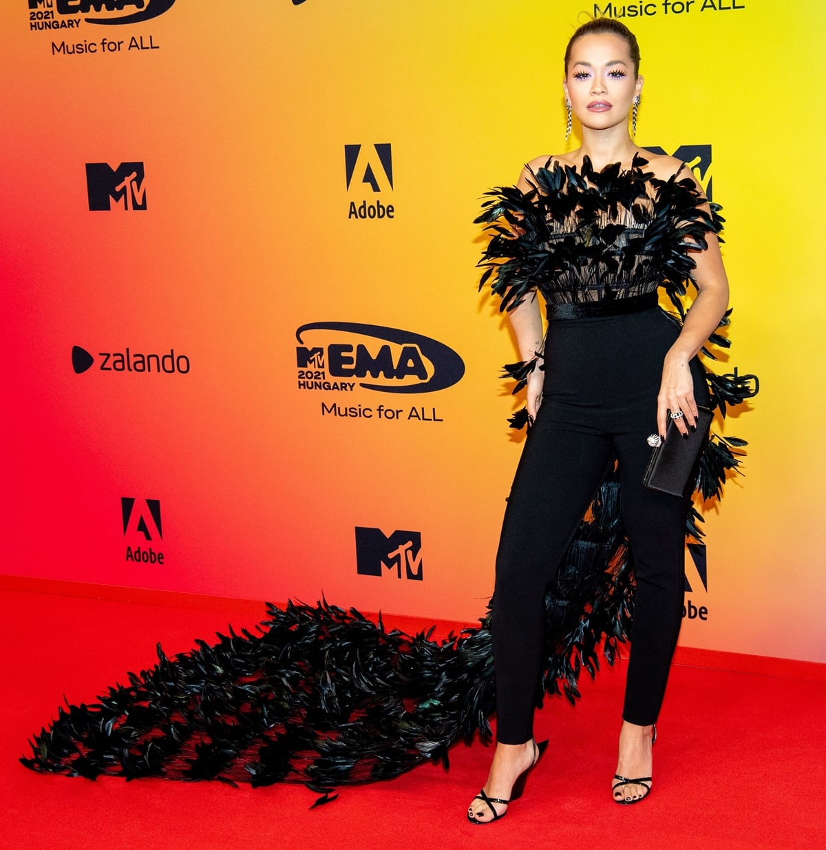 Rita Ora styled her feather jumpsuit dress with futuristic Giuseppe Zanotti Pris 105mm wedge sandals