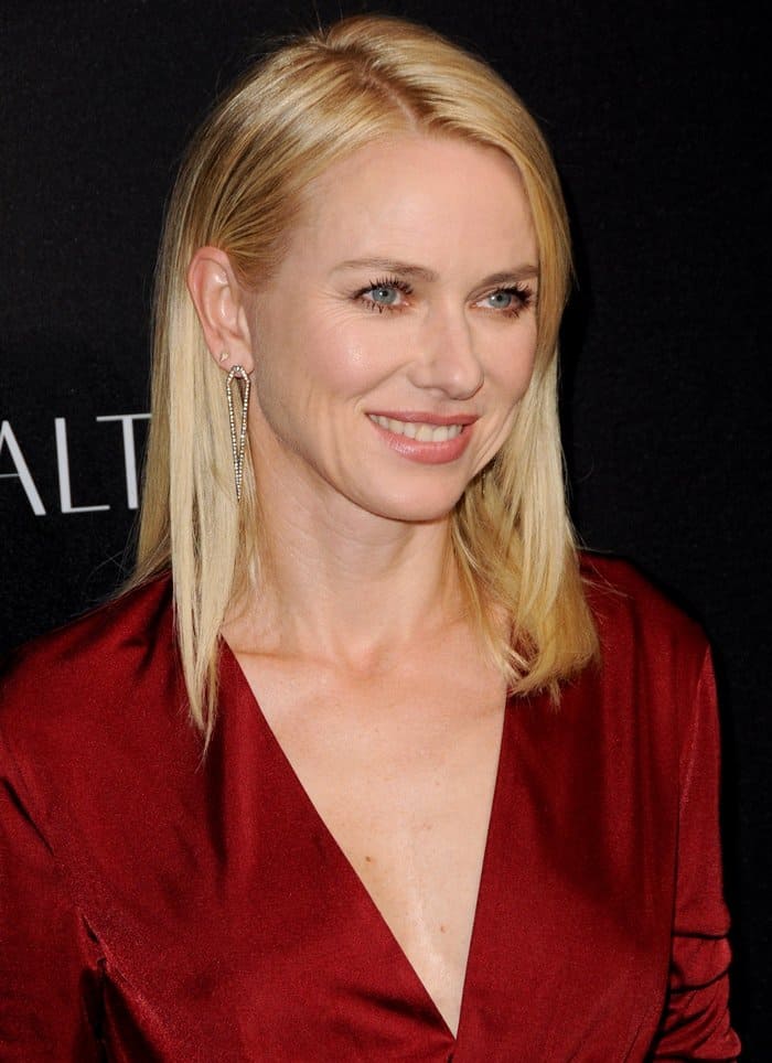 Naomi Watts wore a bold silk red wrap dress and Jennifer Fisher jewelry