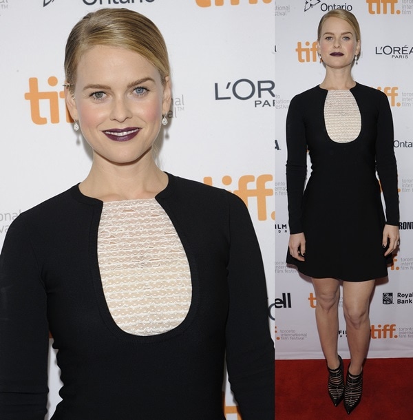 Alice Eve with purple lips and a sleek ponytail