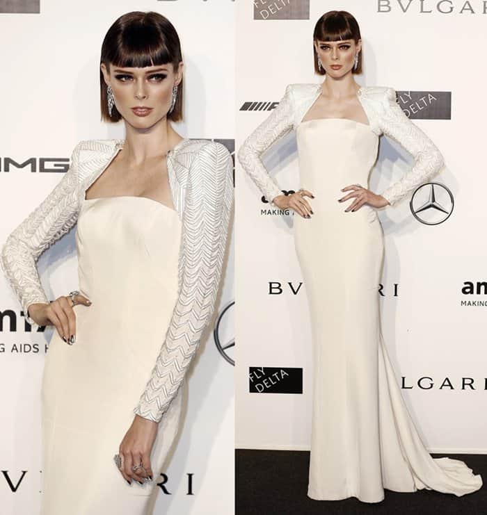 Coco Rocha in a floor-length white Versace dress at the Milan Fashion Week Spring/Summer 2014 amfAR Charity Gala