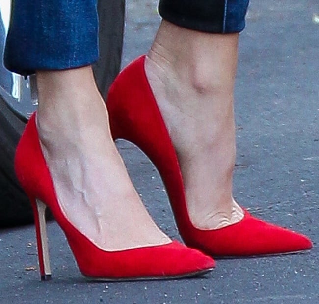 Nikki Reed shows off her feet in red pointy pumps