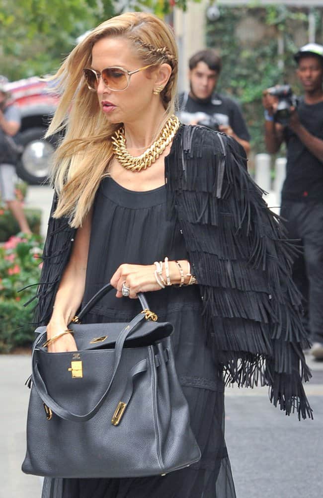 Rachel Zoe exudes style and sophistication as she heads to her car draped in a luxurious fringed cape