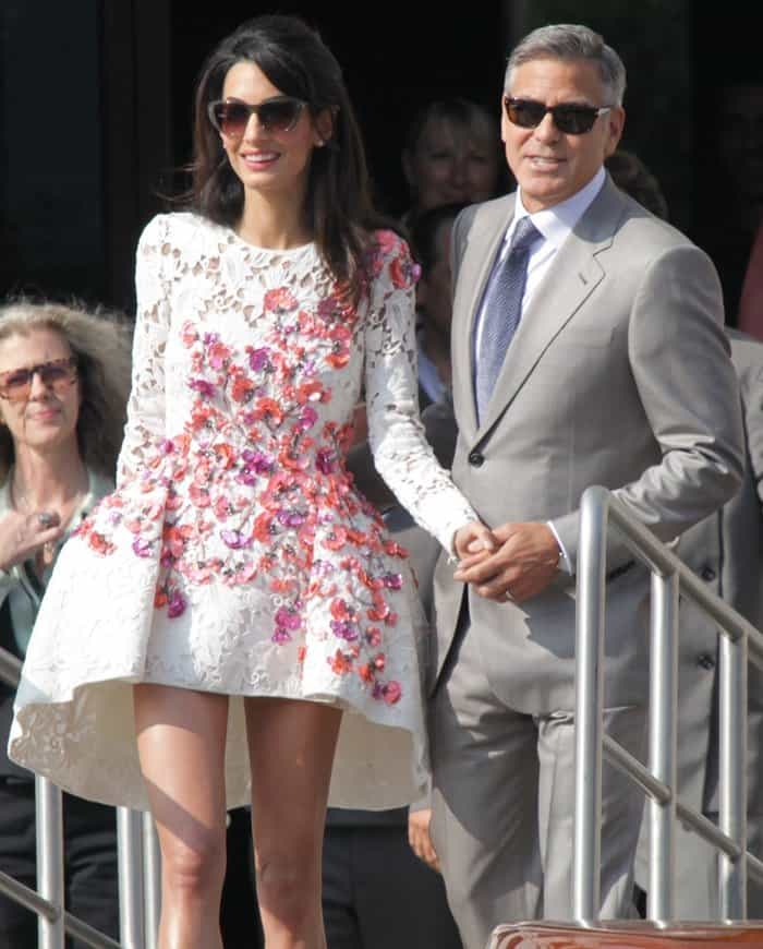 Amal Alamuddin stuns in a floral-embroidered Giambattista Valli Couture dress alongside George Clooney in Venice