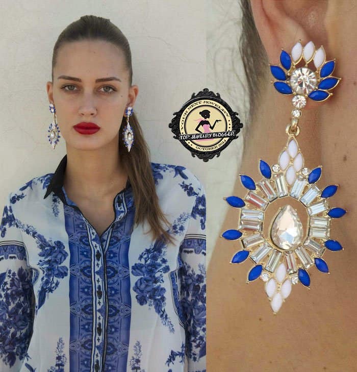 Amina styled a white-and-blue button-down shirt with crystal earrings