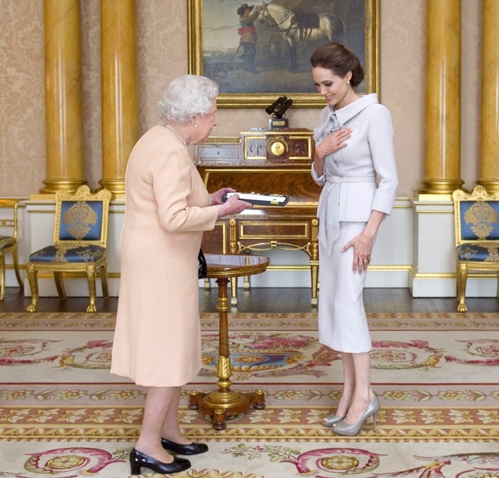 For her meeting with the Queen, Angelina sported a gray wool crepe peplum jacket paired with a pencil skirt from the Ralph & Russo Spring 2014 Couture collection