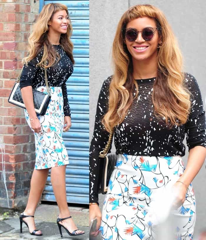 Beyoncé brightens up London in a paint-splattered Generation Love top, Tanya Taylor floral skirt, and Prada ankle-strap heels, accessorized with a classic Chanel Boy bag