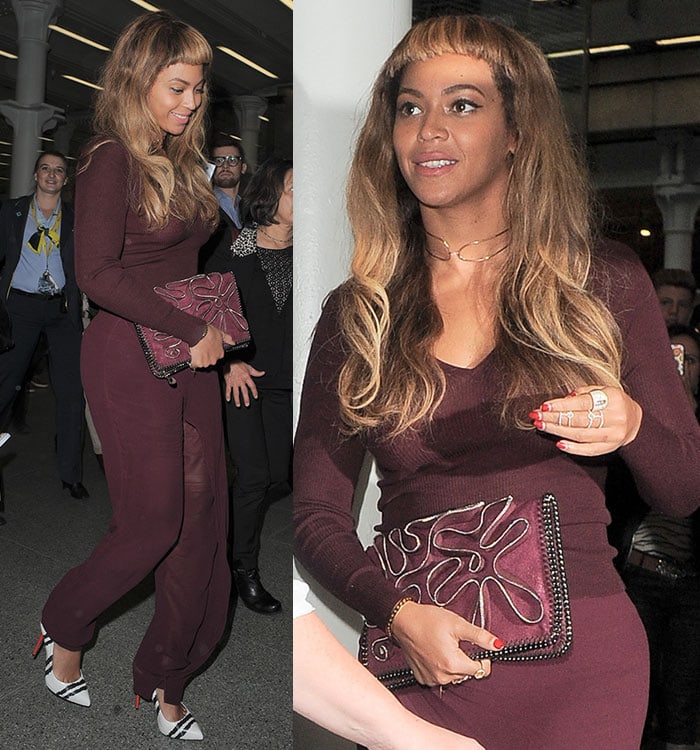 Beyonce carried a matching purse by Stella McCartney and wore a pair of snakeskin pumps with a striped design.