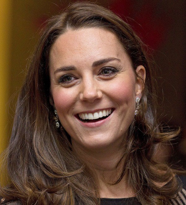 Catherine, Duchess of Cambridge, shows off her diamond earrings and a dazzling smile