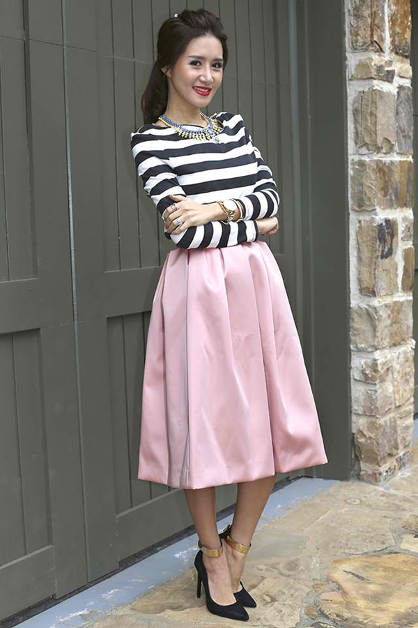 Christina in a striped top with a sweet midi skirt