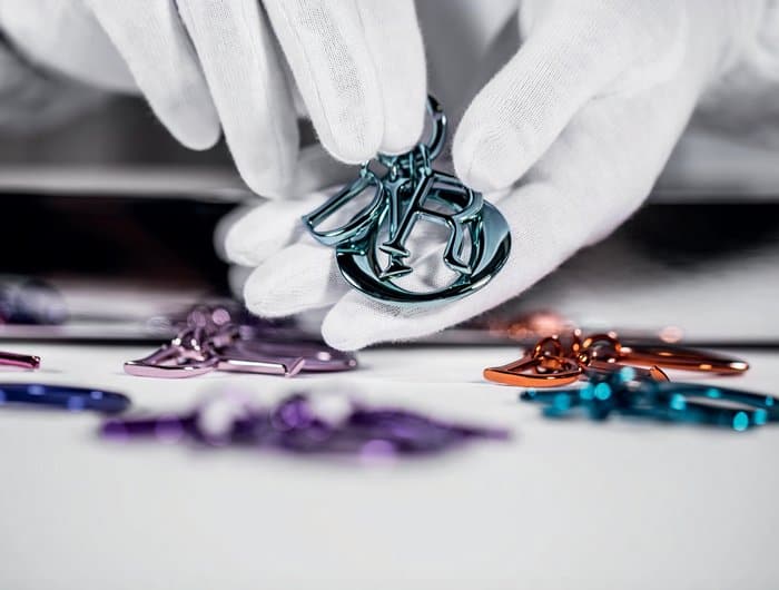 Christian Dior elevates each handbag with meticulously crafted metal charms and vibrant surface embellishments, adding a signature touch of luxury