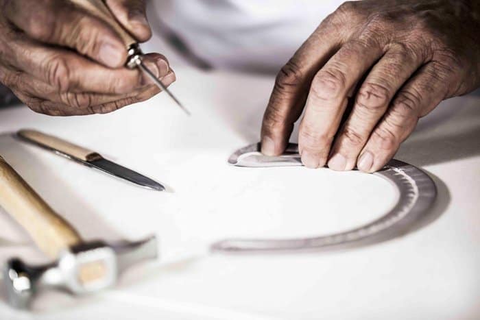 Every Christian Dior bag begins with meticulous craftsmanship, where precision tools and skilled hands bring luxury designs to life