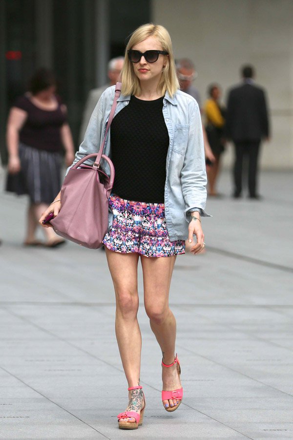 Fearne Cotton paired a light denim jacket with a black top, floral shorts, and pink accented wedge sandals for a breezy, chic summer look in London