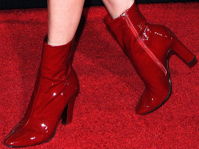 Closeups of Jena Malone's shiny red patent boots