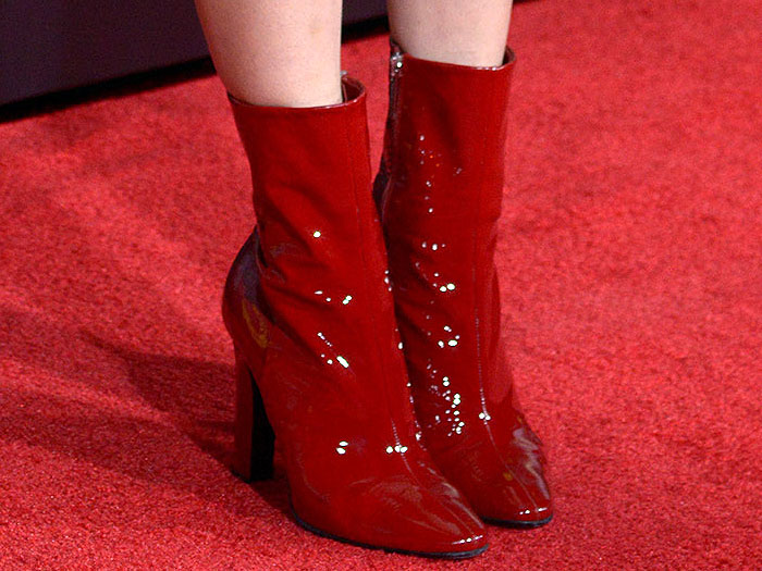 Closeups of Jena Malone's shiny red patent boots