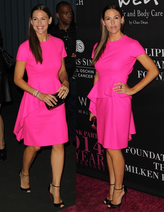 Jennifer Garner donned a bright-pink Dior dress featuring ruffled peplum detailing and a demure knee-length hemline