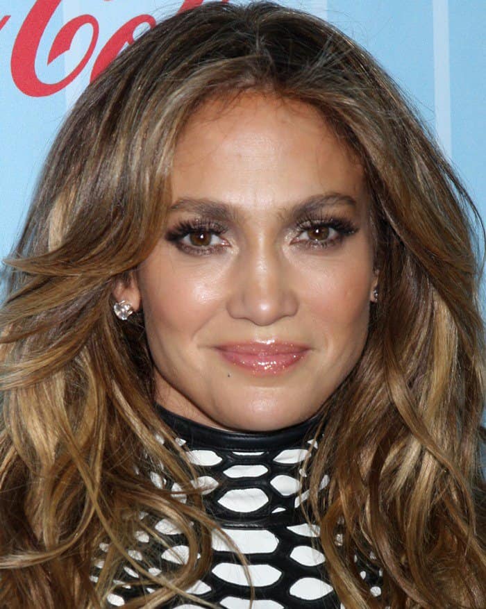 Jennifer Lopez showcases her flawless makeup and wavy locks at the American Idol Season 13 premiere party