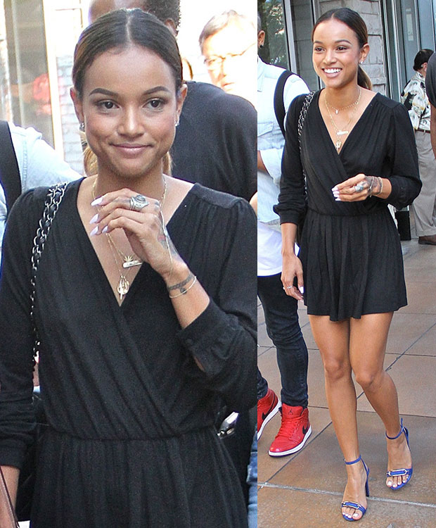 Opting for a flirty leggy look, Karrueche wore a low-cut long-sleeved mini dress and styled it with a few gold necklaces and a pair of blue stilettos.