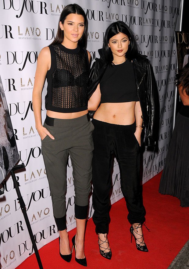 Kendall and Kylie Jenner wearing black crop tops