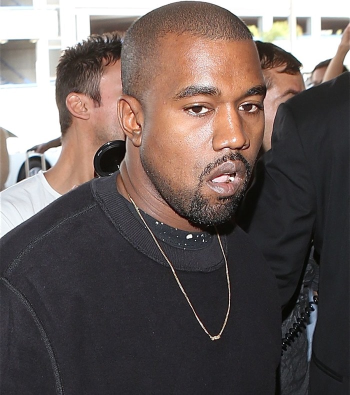 Kanye West was spotted at Los Angeles International Airport (LAX) looking relaxed in a black sweatshirt and minimal gold chain