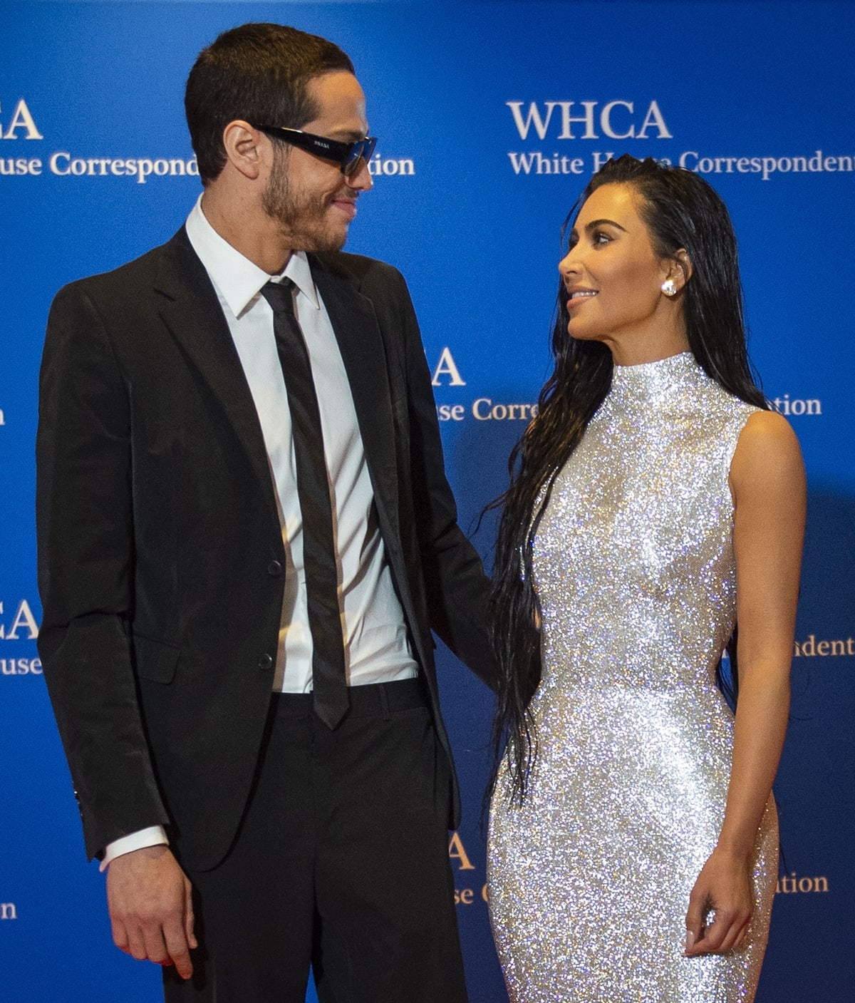 Kim Kardashian and Pete Davidson share a sweet moment on the red carpet at the 2022 White House Correspondents' Dinner, with Kim sparkling in a stunning silver gown