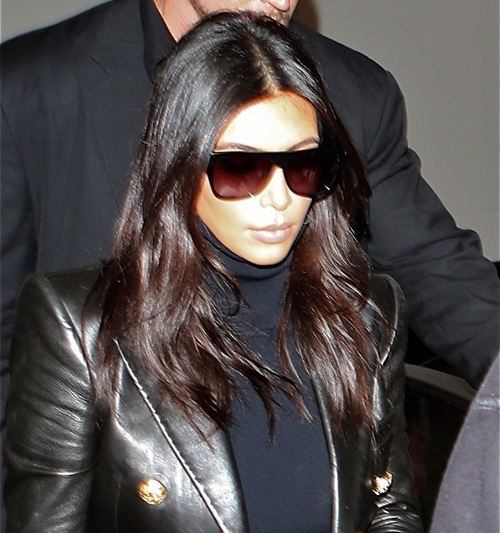 Kim Kardashian in a Balmain leather jacket at Los Angeles International Airport (LAX) on October 26, 2014
