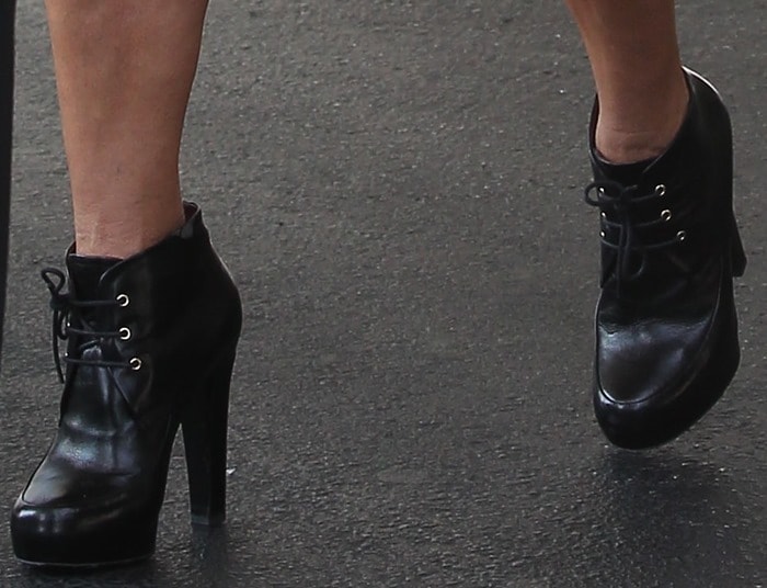 Kris Jenner rocking metal-heeled boots