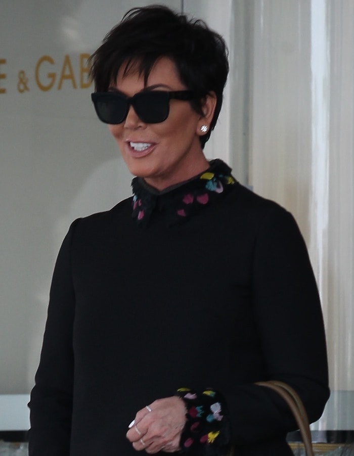 Kris Jenner wearing a black feather-trimmed mini dress in Beverly Hills on October 17, 2014