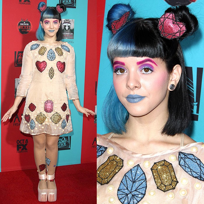 Singer Melanie Martinez posing on the red carpet at the American Horror Story: Freak Show premiere