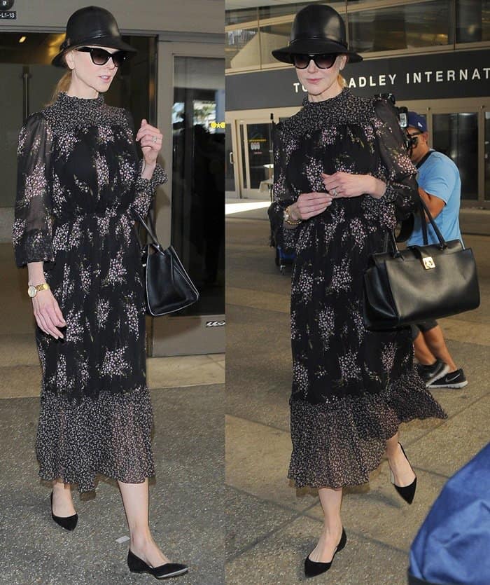 Nicole Kidman steps out at LAX in a chic floral Michael Kors dress, paired with a black leather hat, Salvatore Ferragamo bag, and black flats on October 3, 2014