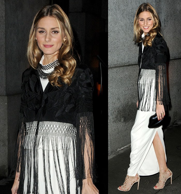 Olivia Palermo in a long cream satin dress and a black embroidered kimono with tassel details