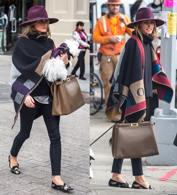 Olivia Palermo shows a stylish layering outfit with a hat and a Burberry color block check blanket poncho