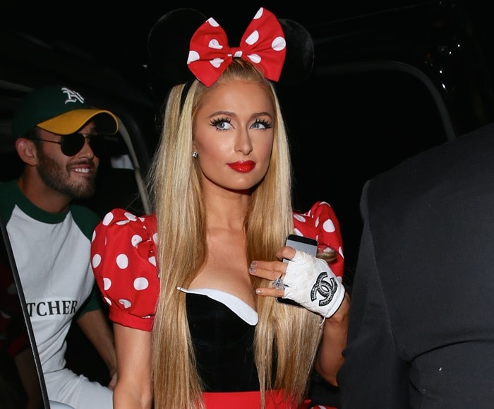 Paris Hilton flashes her impressive boobs at the Casamigos Tequila Halloween Party