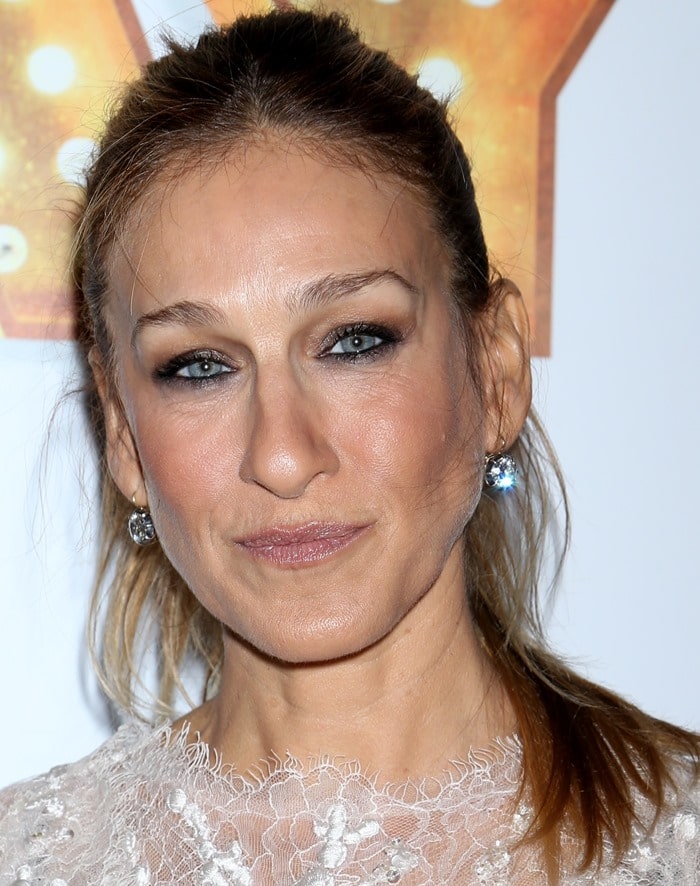 Sarah Jessica Parker showing off her diamond earrings