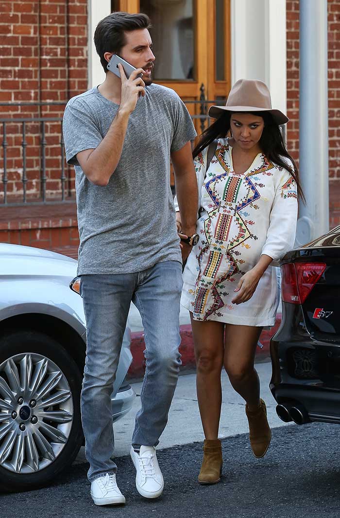 Pregnant reality star Kourtney Kardashian wearing a smock dress by Kate Moss for Topshop