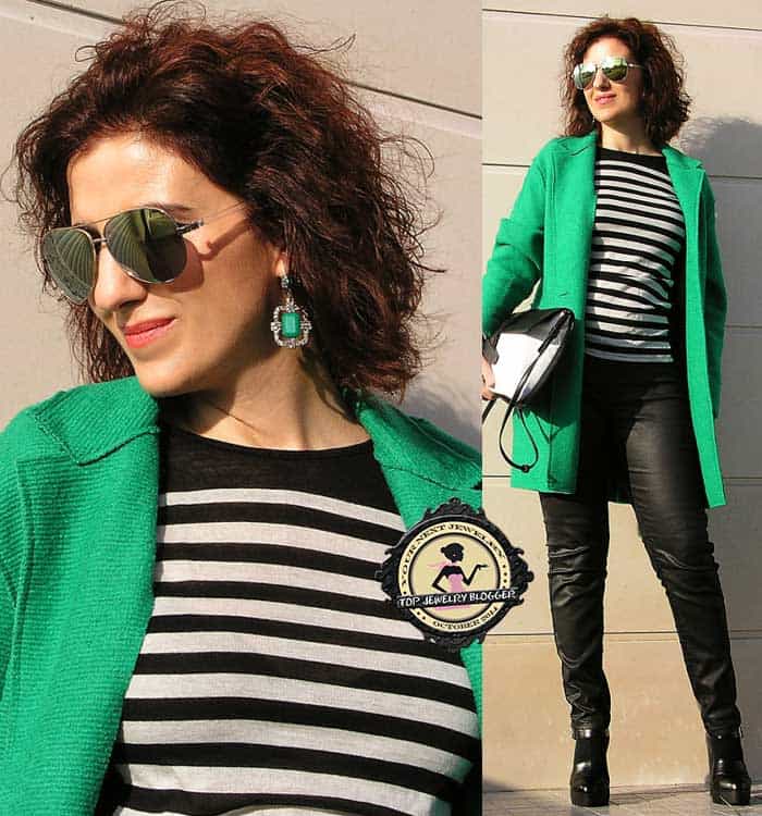 Tanya styled a striped top with a green coat and matching earrings