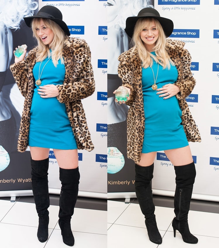 During the launch of her fragrance line at the Westfield London shopping center, the former Pussycat Dolls member rocked a glamorous ensemble consisting of a turquoise blue mini dress paired with a leopard-print coat, a floppy hat, and black thigh-high boots.