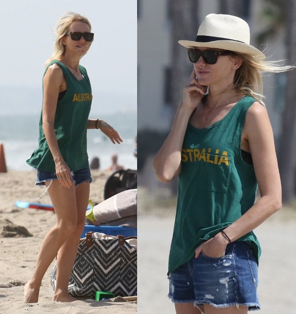 Naomi Watts rocked distressed denim shorts and accessorized with simple flip flops, a short-brimmed straw hat, and a Louis Vuitton tote