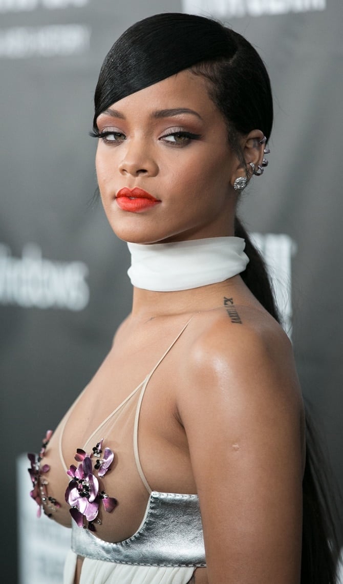Rihanna wearing a see-through white dress to the 2014 amfAR Gala held at Milk Studios in Hollywood on October 29, 2014