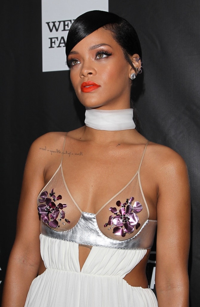 Rihanna wearing a see-through white dress to the 2014 amfAR Gala held at Milk Studios in Hollywood on October 29, 2014