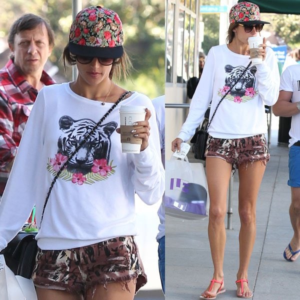 Alessandra Ambrosio wore a Tropical Tiger baggy beach sweatshirt from Wildfox paired with an equally ferocious tiger-stripe printed shorts from One Teaspoon