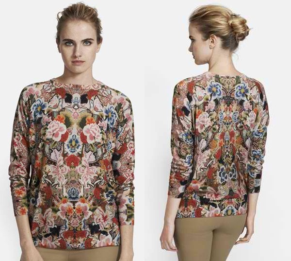 A three-quarter-sleeve crewneck sweater makes a romantic statement thanks to a lavish floral print