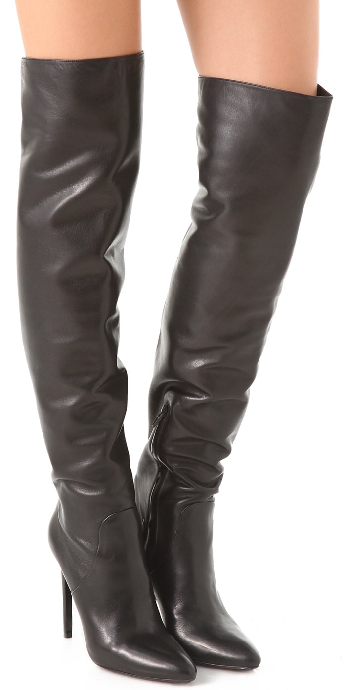 Sleek glazed leather constructs a pair of seductive thigh-high Alexander Wang Sofia boots